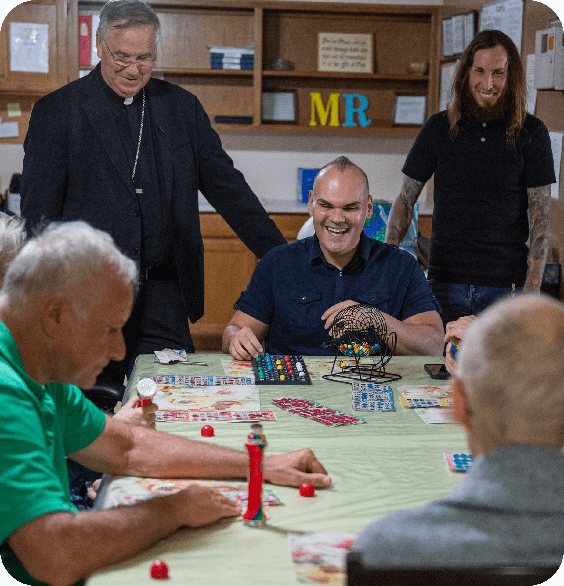 A group of men of various ages playing bingo