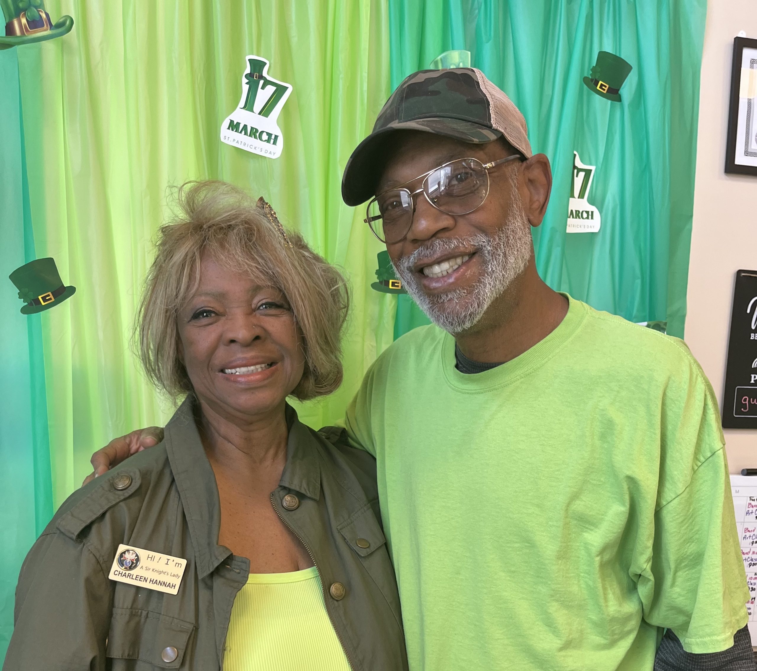 Char & Stan posing together at an AllThrive 365 event for St.Patty's day