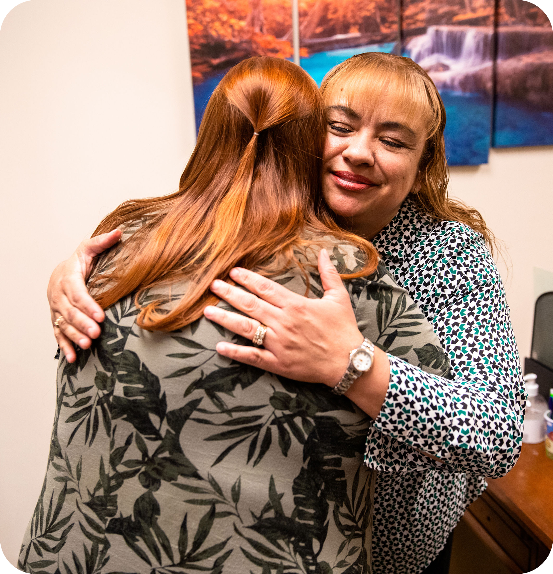 Two women embracing one another