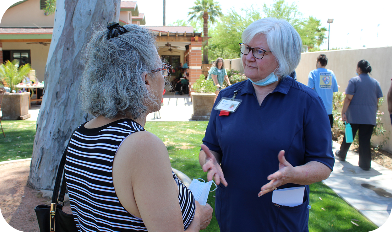 A woman chatting with her nurse